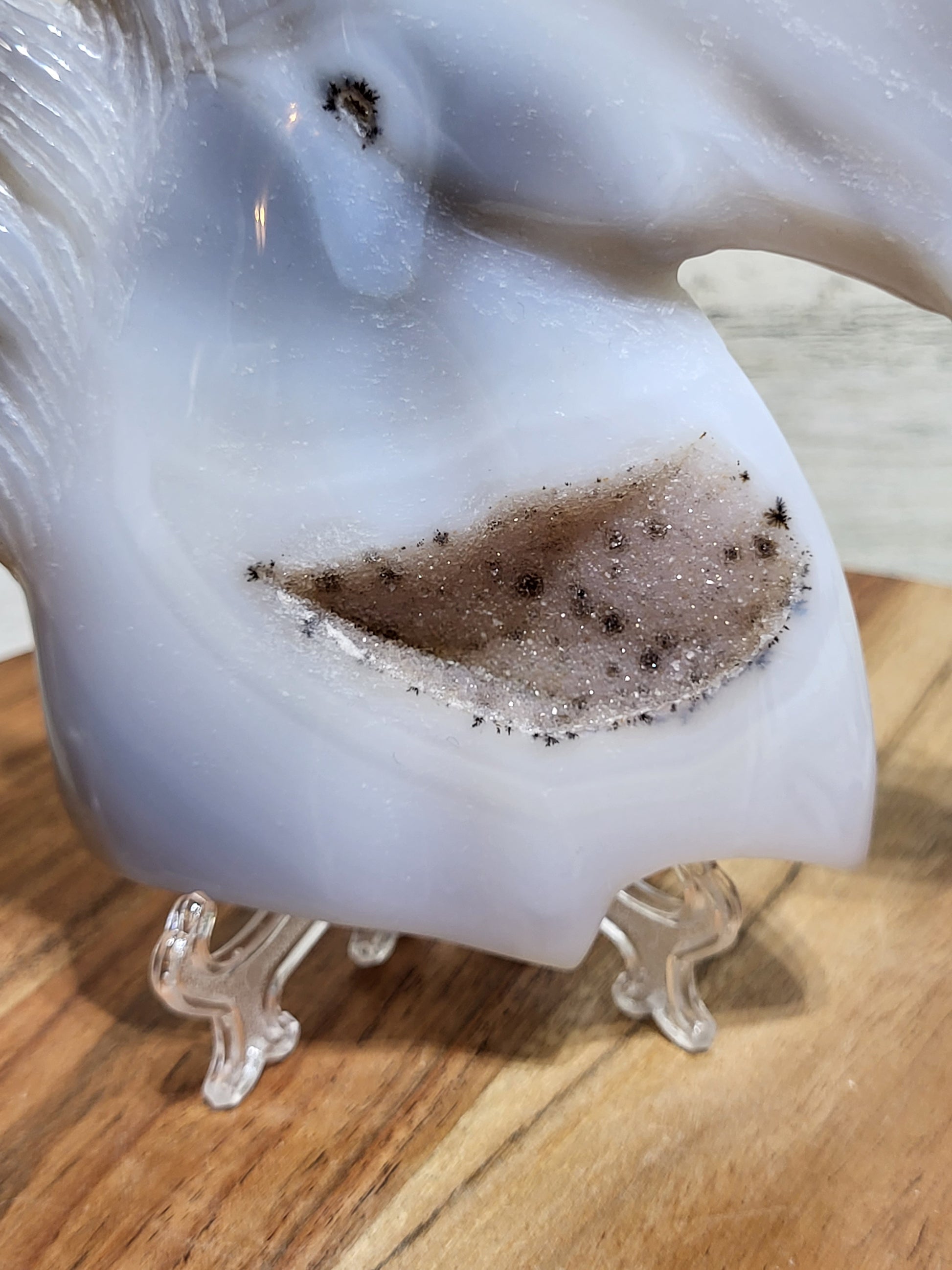Unicorn carving in gray-toned agate with druzy